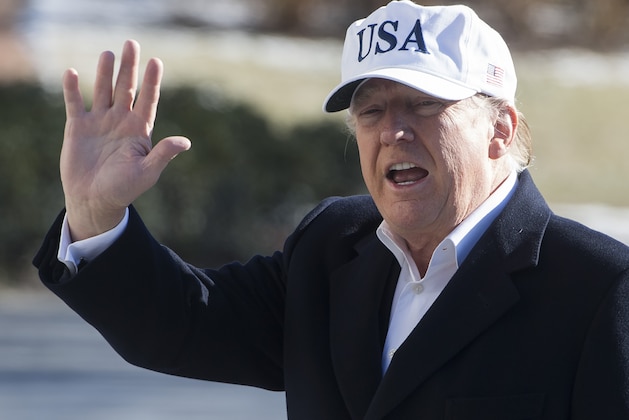 US President Donald Trump waves as he walks from Marine One upon arrival on the South Lawn of the White House in Washington, DC, January 7, 2018, after spending the weekend at Camp David, the Presidential retreat in Maryland. / AFP PHOTO / SAUL LOEB        (Photo credit should read SAUL LOEB/AFP/Getty Images)