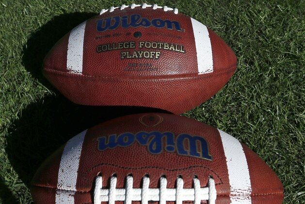Footballs sit on the field during warmups before an NCAA football game between Auburn and Georgia, Saturday, Nov. 14, 2015, in Auburn, Ala. (AP Photo/Butch Dill)