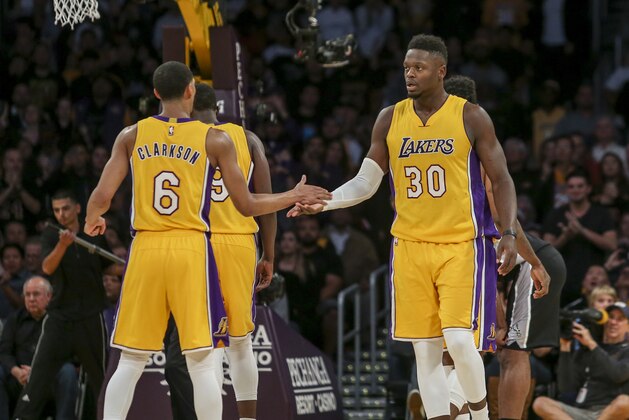 Los Angeles Lakers forward Julius Randle (30), and Jordan Clarkson (6) in an NBA basketball game against San Antonio Spurs Friday, Nov. 18, 2016, in Los Angeles. The Spurs won 116-107. (AP Photo/Ringo H.W. Chiu)