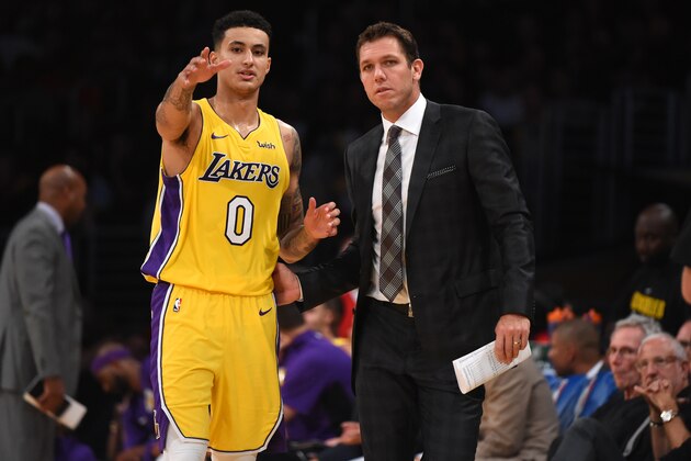 LOS ANGELES, CA - OCTOBER 10:  Kyle Kuzma #0 of the Los Angeles Lakers looks on with Head coach Luke Walton of the Los Angeles Lakers during the preseason game against the Utah Jazz on October 10, 2017 at STAPLES Center in Los Angeles, California. NOTE TO USER: User expressly acknowledges and agrees that, by downloading and/or using this Photograph, user is consenting to the terms and conditions of the Getty Images License Agreement. Mandatory Copyright Notice: Copyright 2017 NBAE (Photo by Adam Pantozzi/NBAE via Getty Images)