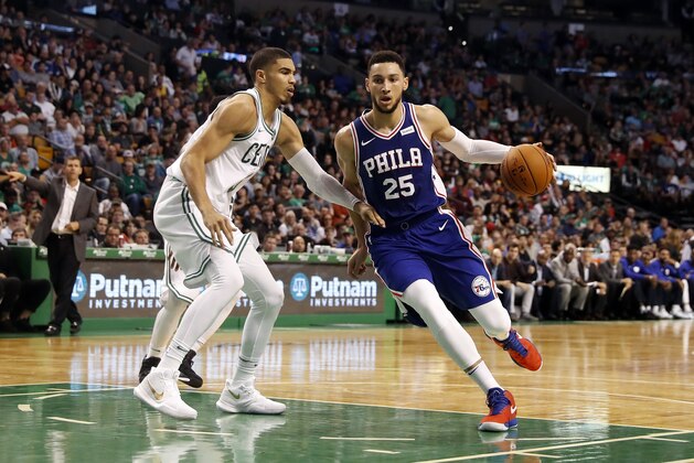 Philadelphia 76ers' Ben Simmons drives on Boston Celtics' Jayson Tatum during the second quarter of a preseason NBA basketball game in Boston Monday, Oct. 9, 2017. (AP Photo/Winslow Townson)