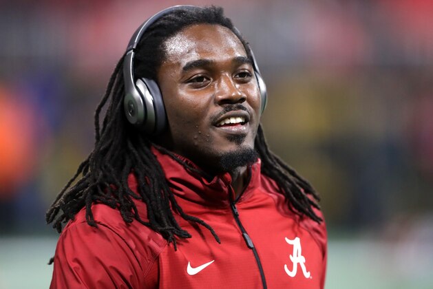 ATLANTA, GA - JANUARY 08:  Bo Scarbrough #9 of the Alabama Crimson Tide warms up prior to the game against the Georgia Bulldogs  in the CFP National Championship presented by AT&T at Mercedes-Benz Stadium on January 8, 2018 in Atlanta, Georgia.  (Photo by Streeter Lecka/Getty Images)