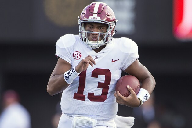 NASHVILLE, TN - SEPTEMBER 23:  Quarterback Tua Tagovailoa #13 of the Alabama Crimson Tide carries the ball during a game against the Vanderbilt Commodores at Vanderbilt Stadium on September 23, 2017 in Nashville, Tennessee.  (Photo by Ronald C. Modra/Sports Imagery/Getty Images)