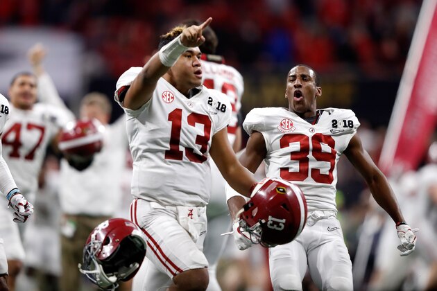 ATLANTA, GA - JANUARY 08:  Tua Tagovailoa #13 of the Alabama Crimson Tide celebrates beating the Georgia Bulldogs in overtime to win the CFP National Championship presented by AT&T at Mercedes-Benz Stadium on January 8, 2018 in Atlanta, Georgia.  (Photo by Jamie Squire/Getty Images)