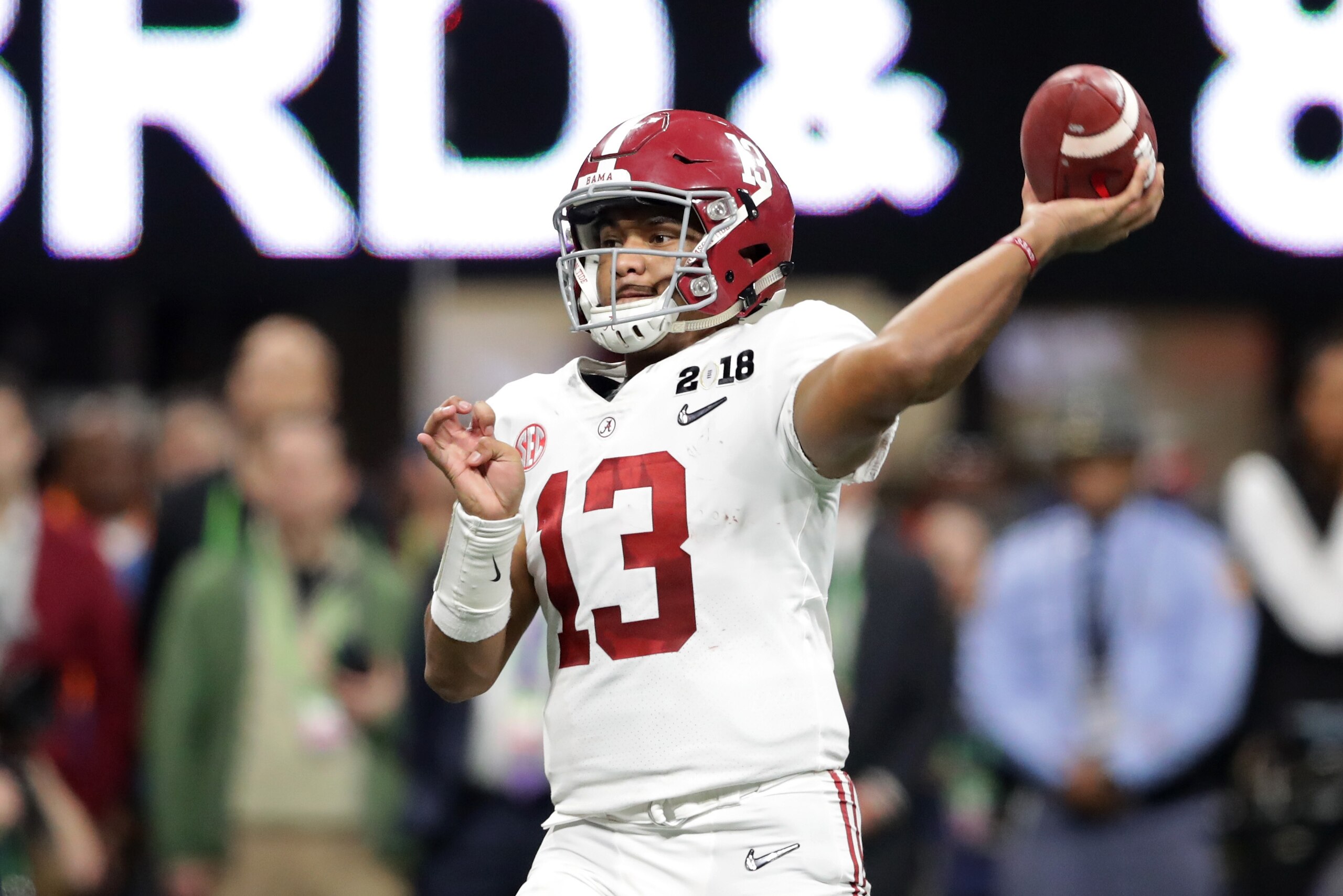 ATLANTA, GA - JANUARY 08: Tua Tagovailoa #13 of the Alabama Crimson Tide throws a pass during the second half against the Georgia Bulldogs in the CFP National Championship presented by AT&T at Mercedes-Benz Stadium on January 8, 2018 in Atlanta, Georgia.  (Photo by Streeter Lecka/Getty Images)