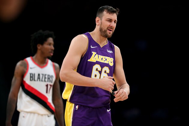 LOS ANGELES, CA - DECEMBER 23:  Andrew Bogut #66 of the Los Angeles Lakers reacts to fouling out as Ed Davis #17 of the Portland Trail Blazers looks on during the second half of a game at Staples Center on December 23, 2017 in Los Angeles, California. NOTE TO USER: User expressly acknowledges and agrees that, by downloading and or using this photograph, User is consenting to the terms and conditions of the Getty Images License Agreement.  (Photo by Sean M. Haffey/Getty Images)