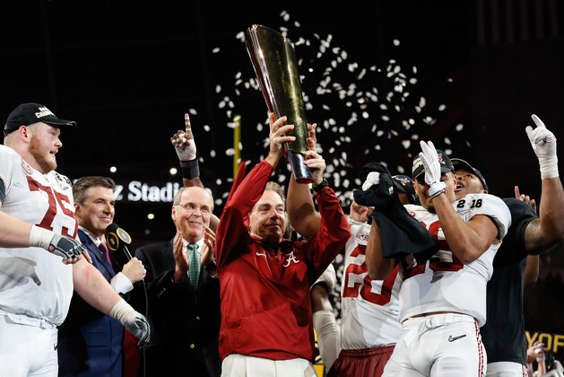 ATLANTA, GA - JANUARY 08:  Head coach Nick Saban of the Alabama Crimson Tide holds the trophy while celebrating with his team after defeating the Georgia Bulldogs in overtime to win the CFP National Championship presented by AT&T at Mercedes-Benz Stadium on January 8, 2018 in Atlanta, Georgia.  (Photo by Jamie Squire/Getty Images)