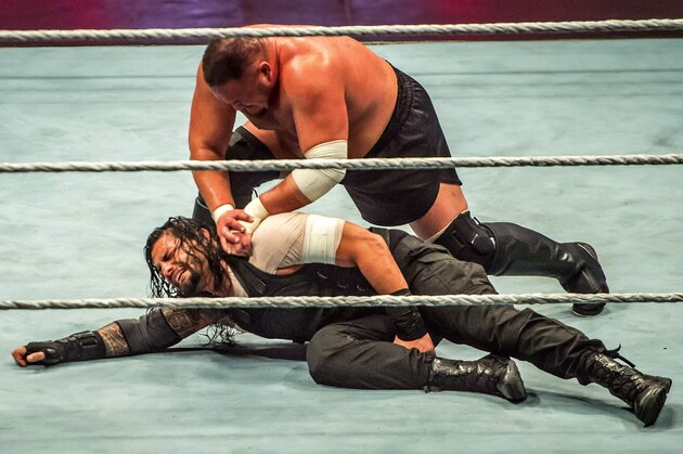Roman and Samoa Joe (R) battle during the WWE show at Zenith Arena on may 09, 2017 in Lille, France. / AFP PHOTO / PHILIPPE HUGUEN        (Photo credit should read PHILIPPE HUGUEN/AFP/Getty Images)