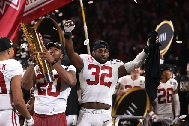 ATLANTA, GA - JANUARY 08: Rashaan Evans #32 of the Alabama Crimson Tide celebrates with his team after defeating the Georgia Bulldogs in overtime to win the CFP National Championship presented by AT&T at Mercedes-Benz Stadium on January 8, 2018 in Atlanta, Georgia.  (Photo by Christian Petersen/Getty Images)