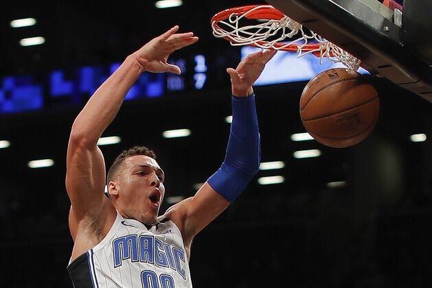 Orlando Magic forward Aaron Gordon (00) dunks the ball against the Brooklyn Nets during the first quarter of an NBA basketball game, Monday, Jan. 1, 2018, in New York. (AP Photo/Julie Jacobson)