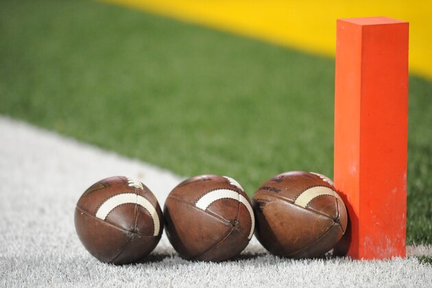 COLLEGE PARK, MD - NOVEMBER 15:  Footballs sit lined up on the field before a college football game between the Michigan State Spartans and the Maryland Terrapins at Byrd Stadium on November 15, 2014 in College Park, Maryland.  (Photo by Mitchell Layton/Getty Images)
