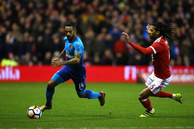 NOTTINGHAM, ENGLAND - JANUARY 07: Theo Walcott of Arsenal beats Armand Traore of Nottingham Forest during the Emirates FA Cup Third Round match between Nottingham Forest and Arsenal at City Ground on January 7, 2018 in Nottingham, England. (Photo by Alex Livesey - Danehouse/Getty Images) NOTTINGHAM, ENGLAND - JANUARY 07: Theo Walcott of Arsenal beats Armand Traore of Nottingham Forest during the Emirates FA Cup Third Round match between Nottingham Forest and Arsenal at City Ground on January 7, 2018 in Nottingham, England. (Photo by Alex Livesey - Danehouse/Getty Images)