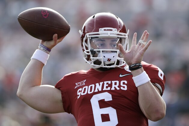 Oklahoma quarterback Baker Mayfield passes during warmups before the Rose Bowl NCAA college football game against Georgia, Monday, Jan. 1, 2018, in Pasadena, Calif. (AP Photo/Gregory Bull)