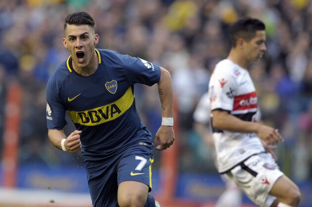 Boca Juniors' forward Cristian Pavon (L) celebrates after scoring a goal against Chacarita Juniors during their Argentina First Division Superliga football match at La Bombonera stadium in Buenos Aires, on October 1, 2017. / AFP PHOTO / ALEJANDRO PAGNI        (Photo credit should read ALEJANDRO PAGNI/AFP/Getty Images)