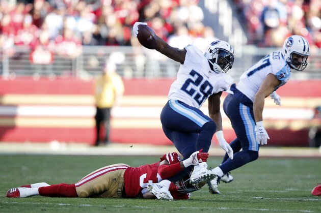 Tennessee Titans running back DeMarco Murray, top, is tackled against the San Francisco 49ers during the second half of an NFL football game Sunday, Dec. 17, 2017, in Santa Clara, Calif. (AP Photo/John Hefti)