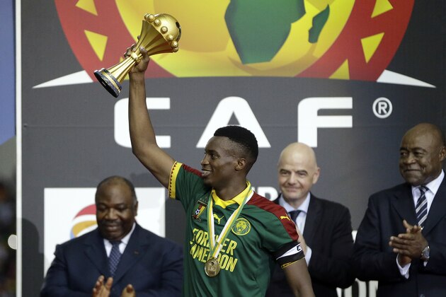 Cameroon's Benjamin Moukandjo lifts the trophy after winning the African Cup of Nations final soccer match between Egypt and Cameroon at the Stade de l'Amitie, in Libreville, Gabon, Sunday, Feb. 5, 2017. Cameroon won 2-1. (AP Photo/Sunday Alamba)