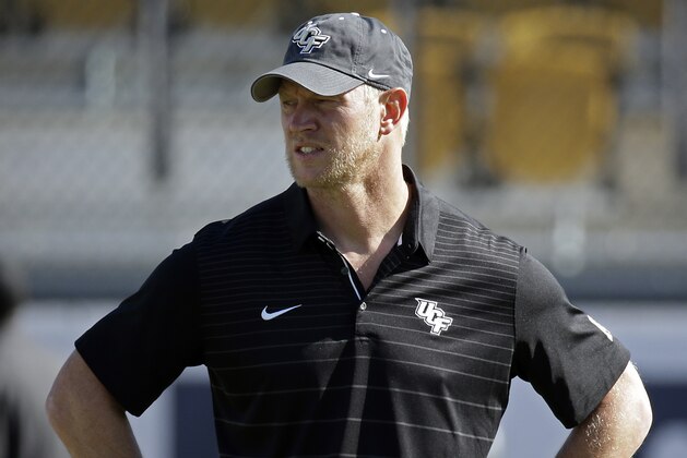 Central Florida head coach Scott Frost watches players warm up before the American Athletic Conference championship NCAA college football game, Saturday, Dec. 2, 2017, in Orlando, Fla. (AP Photo/John Raoux)