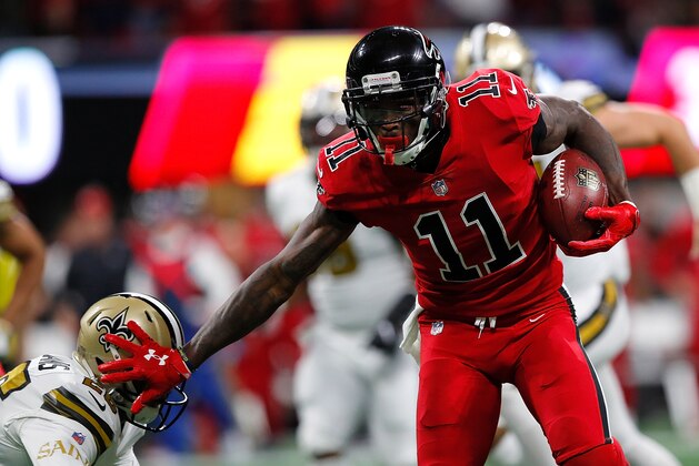 ATLANTA, GA - DECEMBER 07:  Julio Jones #11 of the Atlanta Falcons stiff arms P.J. Williams #26 of the New Orleans Saints after a reception at Mercedes-Benz Stadium on December 7, 2017 in Atlanta, Georgia.  (Photo by Kevin C. Cox/Getty Images)