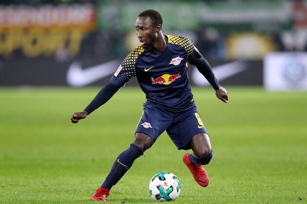 Leipzig's Guinean midfielder Naby Keita runs with the ball during the German first division Bundesliga football match between VfL Wolfsburg and RB Leipzig on December 12, 2017 in Wolfsburg.
 / AFP PHOTO / Ronny Hartmann / RESTRICTIONS: DURING MATCH TIME: DFL RULES TO LIMIT THE ONLINE USAGE TO 15 PICTURES PER MATCH AND FORBID IMAGE SEQUENCES TO SIMULATE VIDEO. == RESTRICTED TO EDITORIAL USE == FOR FURTHER QUERIES PLEASE CONTACT DFL DIRECTLY AT + 49 69 650050
        (Photo credit should read RONNY HARTMANN/AFP/Getty Images)