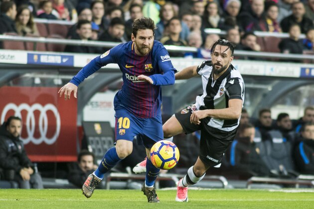 BARCELONA, SPAIN - JANUARY 07: Lionel Andres Messi (L) of FC Barcelona fights for the ball with Ivan Lopez Alvarez, Ivi, of Levante UD during the La Liga match between FC Barcelona and Levante UD at Camp Nou on 07 January 2018 in Barcelona, Spain. (Photo by Power Sport Images/Getty Images)