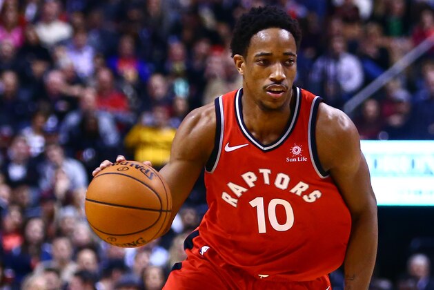 TORONTO, ON - JANUARY 09:  DeMar DeRozan #10 of the Toronto Raptors dribbles the ball during the second half of an NBA game against the Miami Heat at Air Canada Centre on January 9, 2018 in Toronto, Canada.  NOTE TO USER: User expressly acknowledges and agrees that, by downloading and or using this photograph, User is consenting to the terms and conditions of the Getty Images License Agreement.  (Photo by Vaughn Ridley/Getty Images)