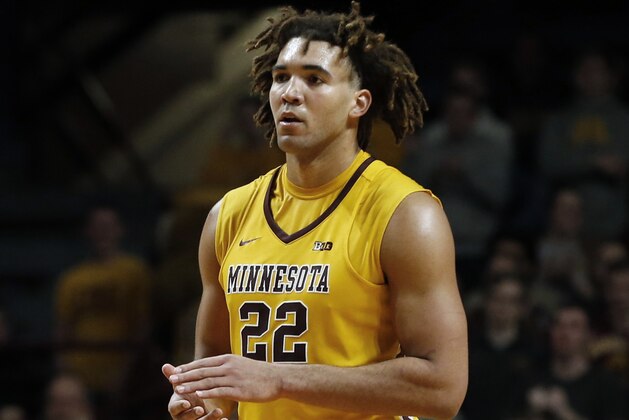 FILE - In this Jan. 3, 2018, file photo, Minnesota center Reggie Lynch plays against Illinois in the second half of an NCAA college basketball game in Minneapolis. Lynch faces suspension over an alleged violation of the school's sexual misconduct policy. The Minneapolis Star Tribune and the St. Paul Pioneer Press report that Lynch was accused last fall by a woman who said he assaulted her in his dorm room in April 2016. (AP Photo/Jim Mone, File)
