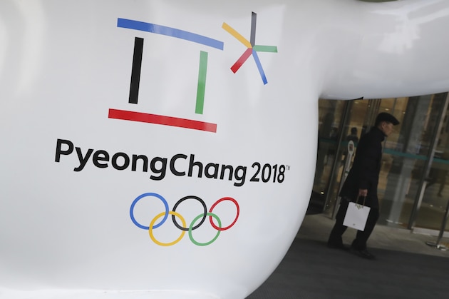 FILE - In this Thursday, Jan. 4, 2018, file photo, the official emblem of the 2018 Pyeongchang Olympic Winter Games is seen in downtown Seoul, South Korea. With little time to spare, North and South Korea are preparing to discuss Kim Jong Un’s offer to send a delegation to next month’s Winter Olympics. (AP Photo/Lee Jin-man)