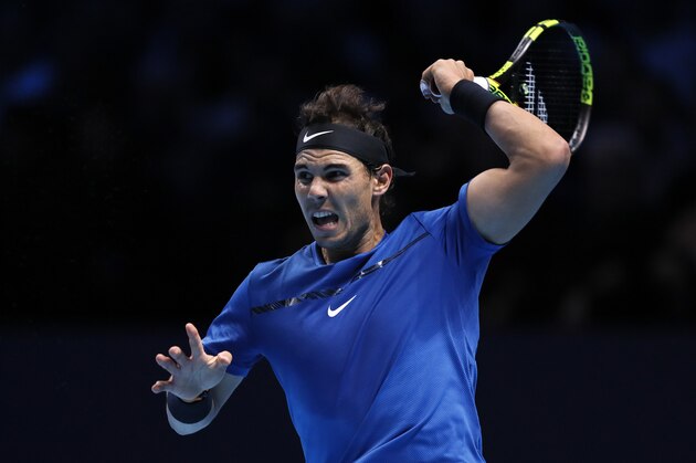 Rafael Nadal of Spain returns to David Goffin of Belgium during their singles tennis match at the ATP World Finals at the O2 Arena in London, Monday, Nov. 13, 2017. (AP Photo/Kirsty Wigglesworth)