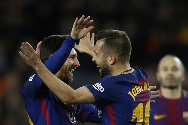 FC Barcelona's Jordi Alba, right, celebrates after scoring with his teammate Lionel Messi during the Spanish Copa del Rey round of 16 second leg soccer match between FC Barcelona and Celta de Vigo at the Camp Nou stadium in Barcelona, Spain, Thursday, Jan. 11, 2018. (AP Photo/Manu Fernandez)