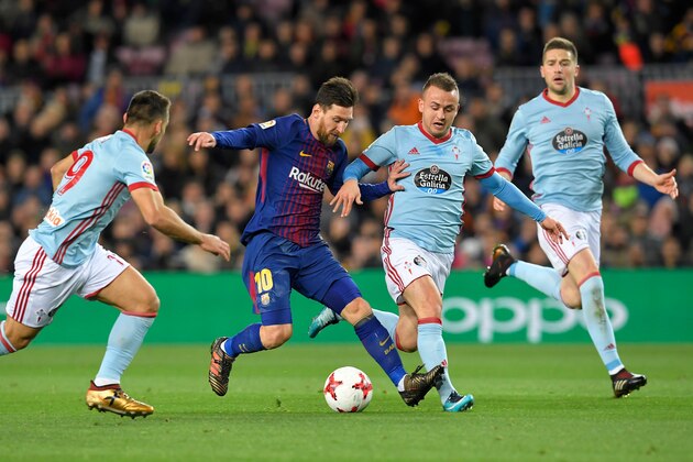 Barcelona's Argentinian forward Lionel Messi (2L) vies with Celta Vigo's Spanish defender Jonny Castro (L) and Celta Vigo's Slovak milfielder Stanislav Lobotka  during the Spanish Copa del Rey (King's Cup) round of 16 second leg football match FC Barcelona vs RC Celta de Vigo at the Camp Nou stadium in Barcelona on January 11, 2018. / AFP PHOTO / LLUIS GENE        (Photo credit should read LLUIS GENE/AFP/Getty Images)
