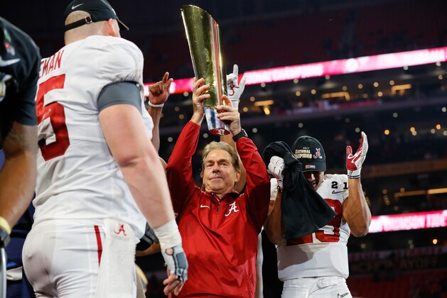 ATLANTA, GA - JANUARY 08:  Head coach Nick Saban of the Alabama Crimson Tide holds the trophy while celebrating with his team after defeating the Georgia Bulldogs in overtime to win the CFP National Championship presented by AT&T at Mercedes-Benz Stadium on January 8, 2018 in Atlanta, Georgia.  (Photo by Kevin C. Cox/Getty Images)