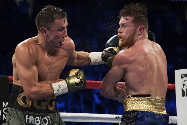 LAS VEGAS, NV - SEPTEMBER 16:  Gennady Golovkin punches Canelo Alvarez during their WBC, WBA and IBF middleweight championship bout at T-Mobile Arena on September 16, 2017 in Las Vegas, Nevada.  (Photo by Al Bello/Getty Images)
