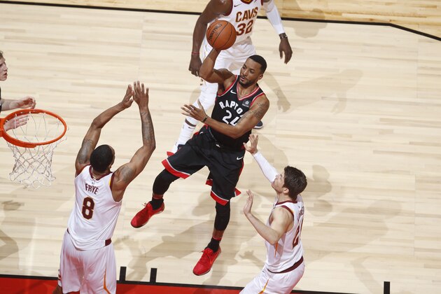 TORONTO, CANADA - JANUARY 11: Norman Powell #24 of the Toronto Raptors shoots the ball against the Cleveland Cavaliers on January 11, 2018 at the Air Canada Centre in Toronto, Ontario, Canada.  NOTE TO USER: User expressly acknowledges and agrees that, by downloading and or using this Photograph, user is consenting to the terms and conditions of the Getty Images License Agreement.  Mandatory Copyright Notice: Copyright 2018 NBAE (Photo by Mark Blinch/NBAE via Getty Images)