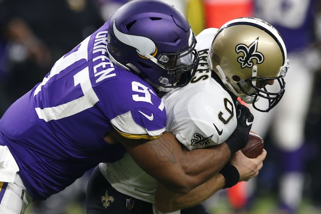 FILE - In this Sept. 11, 2017, file photo, New Orleans Saints quarterback Drew Brees (9) is sacked by Minnesota Vikings defensive end Everson Griffen (97) during the first half of an NFL football game in Minneapolis. The Vikings finally have their first postseason opponent set with the Saints, a team they beat handily in the opener when both teams looked a lot different than they do now. (AP Photo/Jim Mone, File)