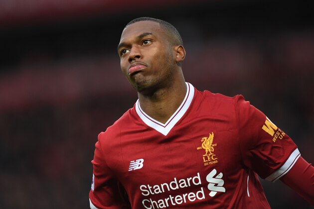 Liverpool's English striker Daniel Sturridge celebrates after scoring the opening goal of the English Premier League football match between Liverpool and Huddersfield Town at Anfield in Liverpool, north west England on October 28, 2017. / AFP PHOTO / Paul ELLIS / RESTRICTED TO EDITORIAL USE. No use with unauthorized audio, video, data, fixture lists, club/league logos or 'live' services. Online in-match use limited to 75 images, no video emulation. No use in betting, games or single club/league/player publications.  /         (Photo credit should read PAUL ELLIS/AFP/Getty Images)