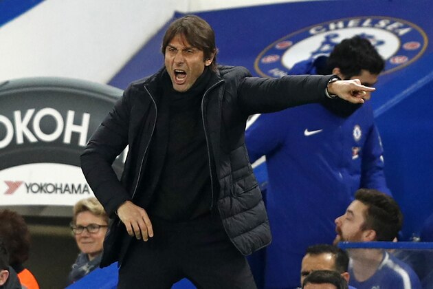 Chelsea's Italian head coach Antonio Conte gestures on the touchline during the English League Cup semi-final first leg football match between Chelsea and Arsenal at Stamford Bridge in London on January 10, 2018. / AFP PHOTO / Adrian DENNIS / RESTRICTED TO EDITORIAL USE. No use with unauthorized audio, video, data, fixture lists, club/league logos or 'live' services. Online in-match use limited to 75 images, no video emulation. No use in betting, games or single club/league/player publications.  /         (Photo credit should read ADRIAN DENNIS/AFP/Getty Images)