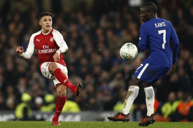 Arsenal's Chilean striker Alexis Sanchez passes the ball during the English League Cup semi-final first leg football match between Chelsea and Arsenal at Stamford Bridge in London on January 10, 2018. / AFP PHOTO / Adrian DENNIS / RESTRICTED TO EDITORIAL USE. No use with unauthorized audio, video, data, fixture lists, club/league logos or 'live' services. Online in-match use limited to 75 images, no video emulation. No use in betting, games or single club/league/player publications.  /         (Photo credit should read ADRIAN DENNIS/AFP/Getty Images)