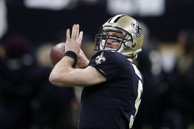 New Orleans Saints quarterback Drew Brees (9) warms up before an NFL wild card playoff football game against the Carolina Panthers in New Orleans, Sunday, Jan. 7, 2018. (AP Photo/Gerald Herbert)