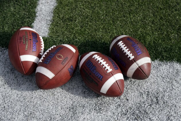 Footballs used by the Northwestern team are seen on the filed before an NCAA college football game against Nebraska in Lincoln, Neb., Saturday, Nov. 4, 2017. (AP Photo/Nati Harnik)