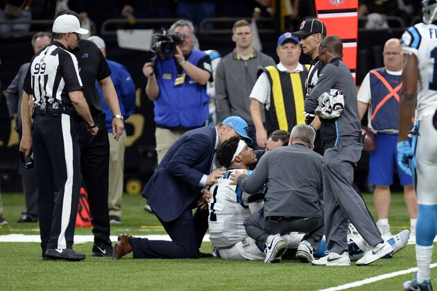Carolina Panthers quarterback Cam Newton (1) is tended to by medical personnel after being sacked in the second half of an NFL football game against the New Orleans Saints in New Orleans, Sunday, Jan. 7, 2018. (AP Photo/Bill Feig)
