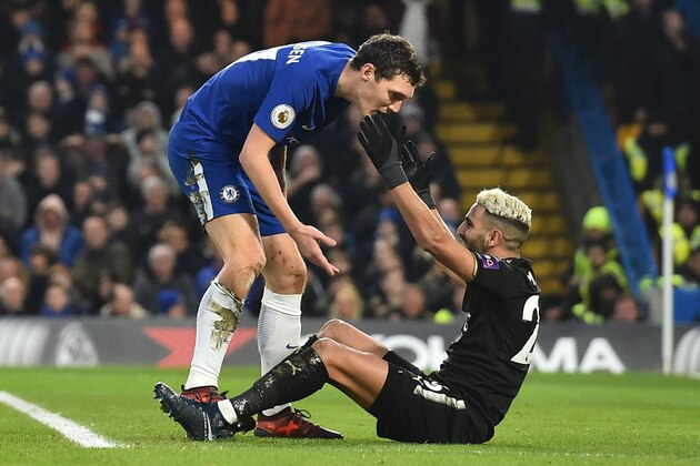 Chelsea's Danish defender Andreas Christensen (L) remonstrates with Leicester City's Algerian midfielder Riyad Mahrez (R) after Mahrez went down in the area during the English Premier League football match between Chelsea and Leicester City at Stamford Bridge in London on January 13, 2018. / AFP PHOTO / Glyn KIRK / RESTRICTED TO EDITORIAL USE. No use with unauthorized audio, video, data, fixture lists, club/league logos or 'live' services. Online in-match use limited to 75 images, no video emulation. No use in betting, games or single club/league/player publications.  /         (Photo credit should read GLYN KIRK/AFP/Getty Images)