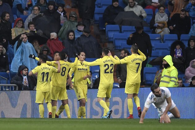 Villarreal's players celebrate after scoring a goal during the Spanish league football match between Real Madrid and Villarreal at the Santiago Bernabeu Stadium in Madrid on January 13, 2018. / AFP PHOTO / GABRIEL BOUYS        (Photo credit should read GABRIEL BOUYS/AFP/Getty Images)