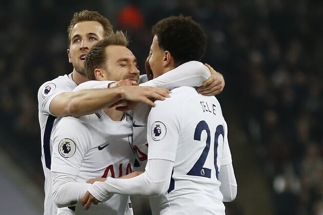 Tottenham Hotspur's Danish midfielder Christian Eriksen (C) celebrates with  Tottenham Hotspur's English midfielder Dele Alli (R) and Tottenham Hotspur's English striker Harry Kane, scoring the team's fourth goal during the English Premier League football match between Tottenham Hotspur and Everton at Wembley Stadium in London, on January 13, 2018. / AFP PHOTO / Ian KINGTON / RESTRICTED TO EDITORIAL USE. No use with unauthorized audio, video, data, fixture lists, club/league logos or 'live' services. Online in-match use limited to 75 images, no video emulation. No use in betting, games or single club/league/player publications.  /         (Photo credit should read IAN KINGTON/AFP/Getty Images)