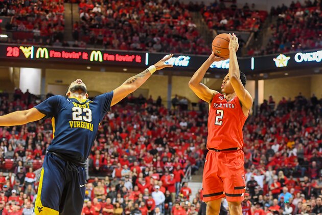 LUBBOCK, TX - JANUARY 13: Zhaire Smith #2 of the Texas Tech Red Raiders shoots the ball over Esa Ahmad #23 of the West Virginia Mountaineers during the first half of the game on January 13, 2018 at United Supermarket Arena in Lubbock, Texas. (Photo by John Weast/Getty Images)