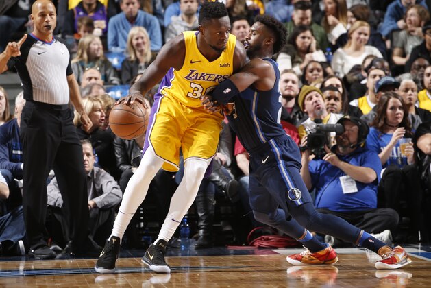 DALLAS, TX - JANUARY 13: Julius Randle #30 of the Los Angeles Lakers handles the ball against Wesley Matthews #23 of the Dallas Mavericks on January 13, 2018 at the American Airlines Center in Dallas, Texas. NOTE TO USER: User expressly acknowledges and agrees that, by downloading and or using this photograph, User is consenting to the terms and conditions of the Getty Images License Agreement. Mandatory Copyright Notice: Copyright 2018 NBAE (Photo by Glenn James/NBAE via Getty Images) DALLAS, TX - JANUARY 13: Julius Randle #30 of the Los Angeles Lakers handles the ball against Wesley Matthews #23 of the Dallas Mavericks on January 13, 2018 at the American Airlines Center in Dallas, Texas. NOTE TO USER: User expressly acknowledges and agrees that, by downloading and or using this photograph, User is consenting to the terms and conditions of the Getty Images License Agreement. Mandatory Copyright Notice: Copyright 2018 NBAE (Photo by Glenn James/NBAE via Getty Images)