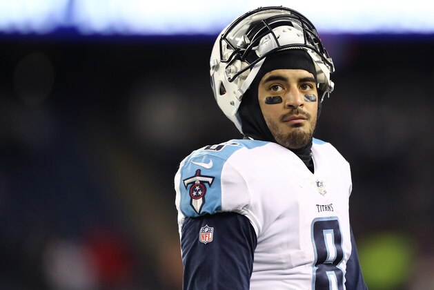 FOXBOROUGH, MA - JANUARY 13:  Marcus Mariota #8 of the Tennessee Titans reacts after the AFC Divisional Playoff game against the New England Patriots at Gillette Stadium on January 13, 2018 in Foxborough, Massachusetts.  (Photo by Elsa/Getty Images)