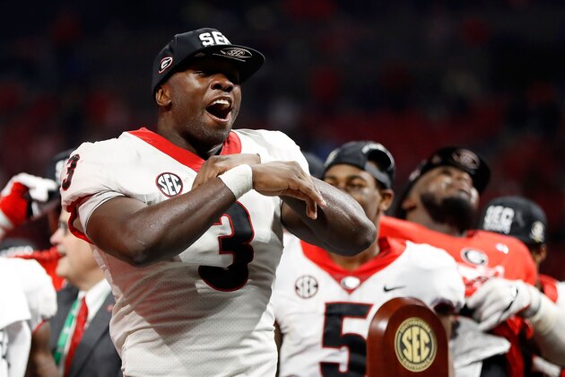ATLANTA, GA - DECEMBER 02: Roquan Smith #3 of the Georgia Bulldogs reacts to winning the game MVP trophy after beating the Auburn Tigers in the SEC Championship at Mercedes-Benz Stadium on December 2, 2017 in Atlanta, Georgia. (Photo by Jamie Squire/Getty Images)