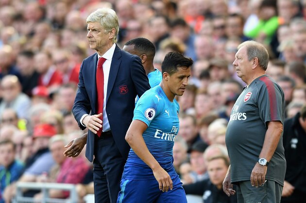 LIVERPOOL, ENGLAND - AUGUST 27:  Alexis Sanchez of Arsenal and Arsene Wenger, Manager of Arsenal embrace after he is subbed during the Premier League match between Liverpool and Arsenal at Anfield on August 27, 2017 in Liverpool, England.  (Photo by Michael Regan/Getty Images)