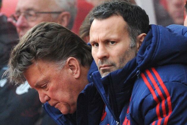 FILE - This is a  Saturday, Dec. 26, 2015 file photo of Manchester United  assistant manager Ryan Giggs, foreground,  and manager Louis van Gaal,  swatch the English Premier League soccer match between Stoke City and Manchester United at the Britannia Stadium, Stoke on Trent, England. Ryan Giggs Friday July 1, 2016  ended his 29-year association with Manchester United, leaving the coaching staff at the fallen Premier League powers at the start of Jose Mourinho’s reign.  The 42-year-old Giggs joined United in 1987 as a 14-year-old went on to play a record 963 times for the first team, mostly under Alex Ferguson.(AP Photo/Rui Vieira, File)