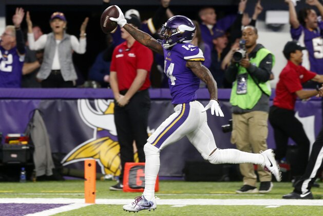 Minnesota Vikings wide receiver Stefon Riggs (14) runs in for a game winning touchdown against the New Orleans Saints during the second half of an NFL divisional football playoff game in Minneapolis, Sunday, Jan. 14, 2018. The Vikings defeated the Saints 29-24.(AP Photo/Jim Mone)